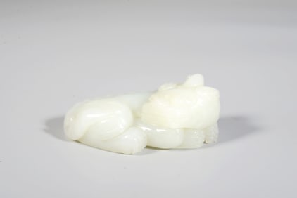 A White Jade Auspicious Beast Hand Piece
