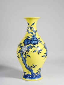 A Yellow-Ground Blue and White "Nine Peaches" Olive Vase