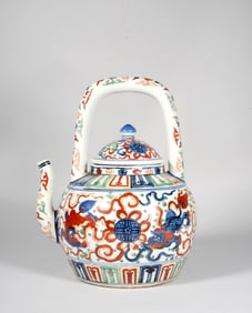 A Blue and White and Wucai "Lion Playing with Ball" Teapot