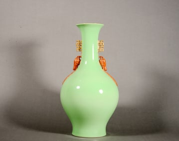 An Apple Green Glazed "Swastika" Ear Vase