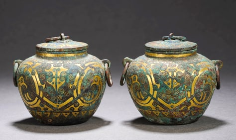 A Pair of Gold-Inlaid Covered Jars