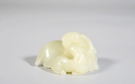 A Celadon and White Jade "Auspicious Joy" Ornament
