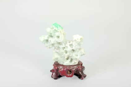 A JADEITE CARVING OF INSECTS ON MOUNTAIN