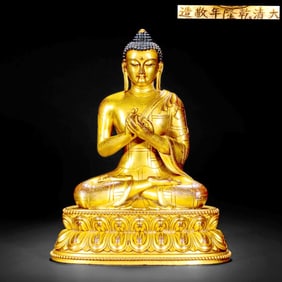 A GILT-BRONZE STATUE OF SHAKYAMUNI