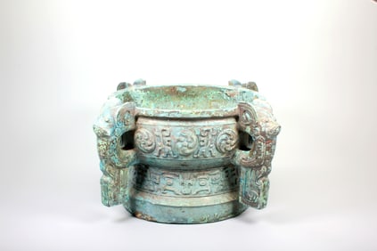 A BRONZE GUI WITH TAOTIE AND VORTEX PATTERNS