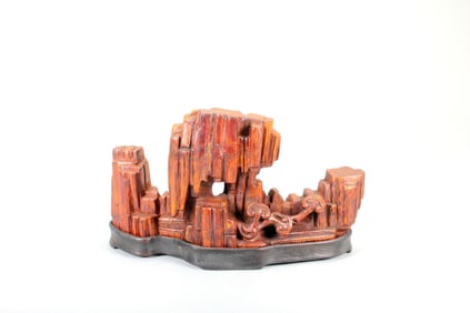 A BAMBOO CARVING OF MOUNTAIN AND CAVE