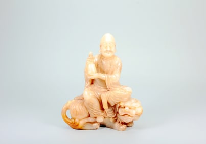 A SHOUSHAN STONE STATUE OF ARHAT SUBDUING TIGER