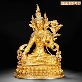 A GILT-BRONZE STATUE OF TARA