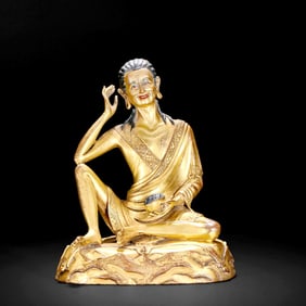 A GILT-BRONZE STATUE OF MILAREPA