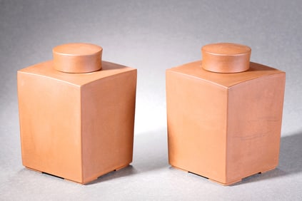 A SET OF PURPLE CLAY JARS