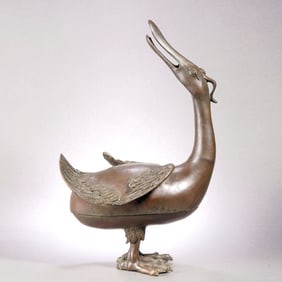 A BRONZE DUCK-SHAPED CENSER