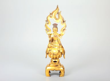 A GILT-BRONZE BENCH-SHAPED BUDDHA STATUE