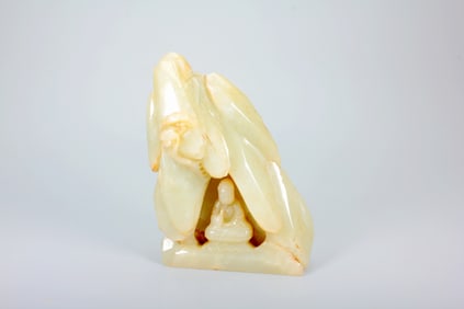 A HETIAN JADE STATUE OF BUDDHA IN CAVE