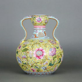 A Yellow-Ground Famille Rose 'Lingzhi And Flower' Ruyi-Handled Garlic-Head Bottle