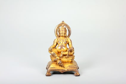 A GILT-BRONZE STATUE OF YELLOW JAMBHALA