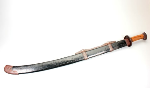 AN OFFICIAL SWORD WITH GOLD-SILVER WAVY BLADE