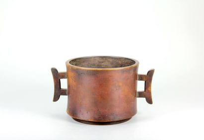 A BRONZE CENSER WITH FLARED HANDLES