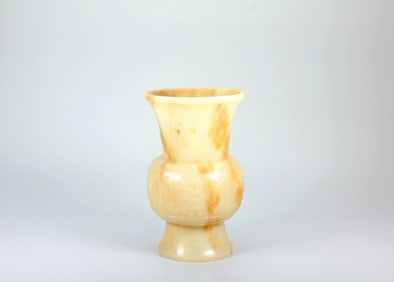A HETIAN JADE FLOWER HOLDER WITH BEAST-FACE PATTERN