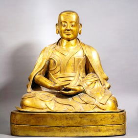 A GILT-BRONZE BUDDHA STATUE