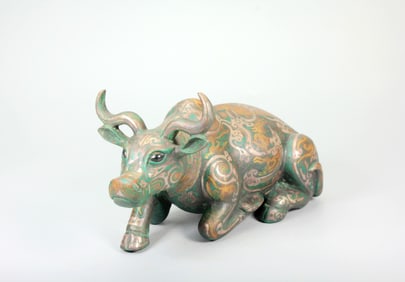 A BRONZE OX WITH GOLD-SILVER INLAY
