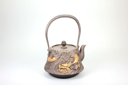 A TIBETAN IRON TEAPOT WITH DRAGON PATTERN (BY ZANGLIU)