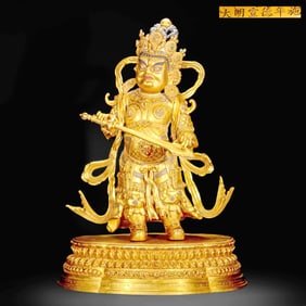 A GILT-BRONZE STATUE OF LOKAPALA