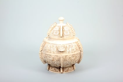 A CHICKEN-BONE WHITE JADE BU WITH KUILONG PATTERN