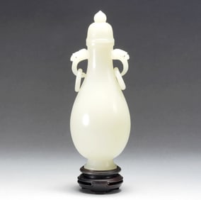 A WHITE JADE VASE