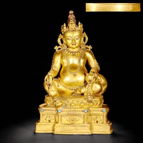 A GILT-BRONZE STATUE OF WEALTH DEITY