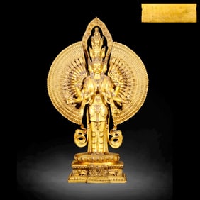 A GILT-BRONZE STATUE OF THOUSAND-ARMED GUANYIN
