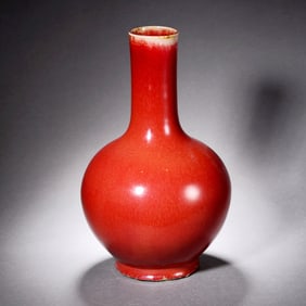 A SACRIFICIAL RED-GLAZED GLOBULAR VASE