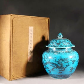 A COVERED JAR WITH DRAGON PATTERN