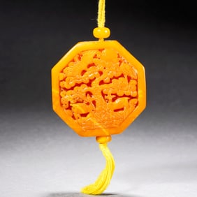 AN AMBER PENDANT
