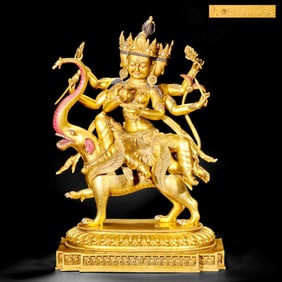 A GILT-BRONZE STATUE OF GUANYIN RIDING ELEPHANT