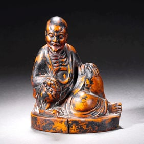 A FIGURAL ORNAMENT