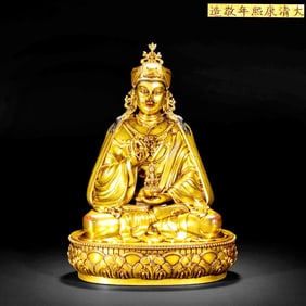 A GILT-BRONZE STATUE OF PADMASAMBHAVA