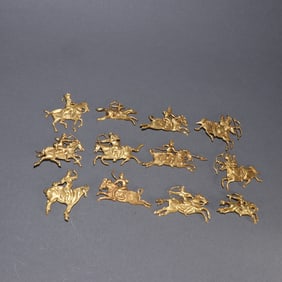 Group of Twelve Gilt Silver Carved Character and Horse Pattern Ornament