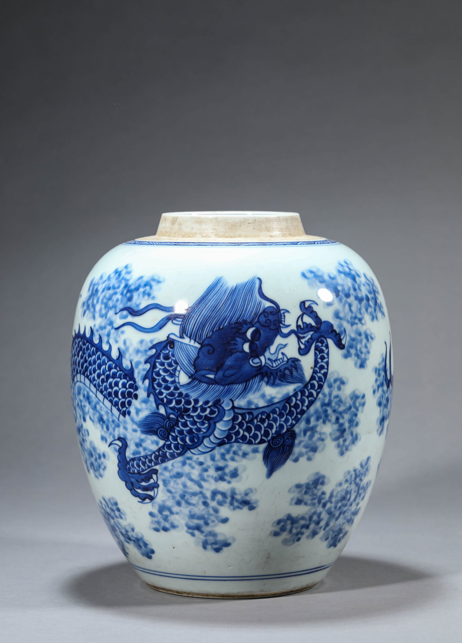 A Blue and White 'Dragon-Through-Clouds' Jar: A Blue and White 'Dragon-Through-Clouds' Jar (21.7 x 26.5cm)