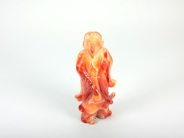 A BANDED AGATE FIGURE OF IMMORTAL