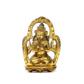 A GILT-BRONZE FIGURE OF A DEITY