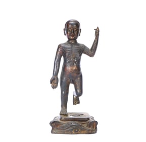 A GILT-BRONZE FIGURE OF A CHILD