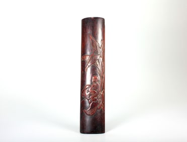 A ZITAN WRIST REST CARVED WITH 'LADY AND PLANTAIN' DESIGN
