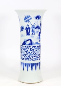 A BLUE AND WHITE 'FIGURE' BEAKER