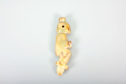 A HETIAN JADE FIGURINE
