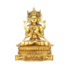 A GILT-BRONZE FIGURE OF A THREE-FACED BUDDHA