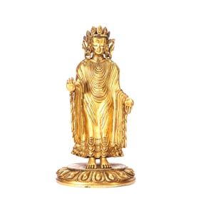A GILT-BRONZE FIGURE OF SANDALWOOD BUDDHA