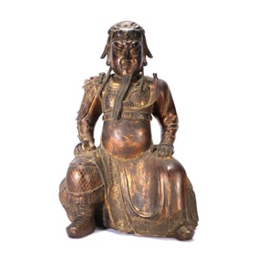 A GILT-BRONZE FIGURE OF GUANYU