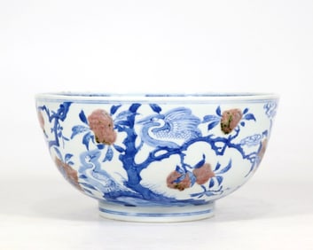 A BLUE AND WHITE AND UNDERGLAZE-RED 'CRANE AND PEACH' BOWL