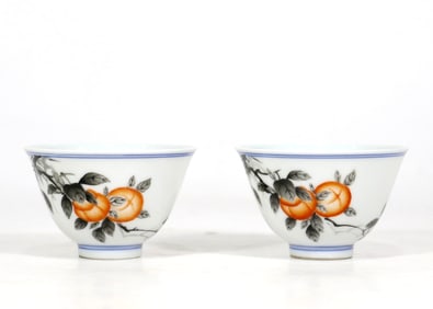 A PAIR OF IRON-RED 'PERSIMMON' CUPS