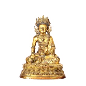 A GILT-BRONZE FIGURE OF SHAKYAMUNI